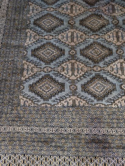 Brown-background Oriental rug with geometric...