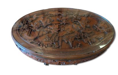 CHINA
Carved wooden coffee table with a glass...