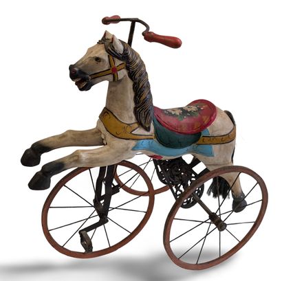 Metal and lacquered wood tricycle featuring...