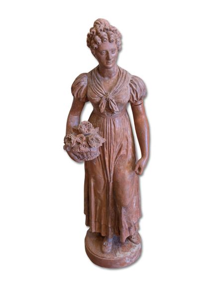 Terracotta garden sculpture depicting a young...
