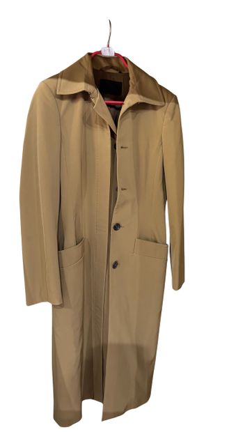 PRADA
Imperméable long beige en matière synthétique,...