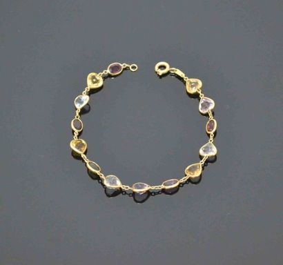 BRACELET en or jaune orné de pierre fines...
