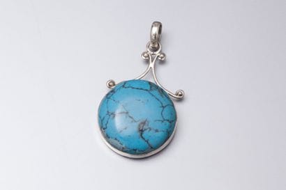 Pendentif en argent et turquoise reconstituée...