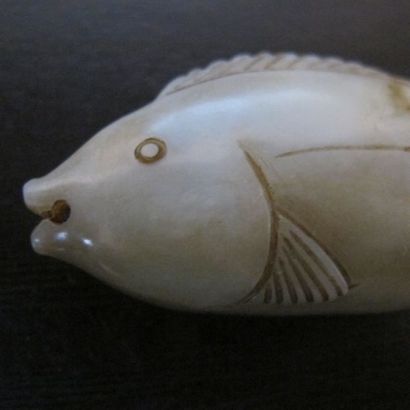 Pendentif en forme de poisson, symbole d’abondance....