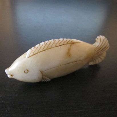 Pendentif en forme de poisson, symbole d’abondance....