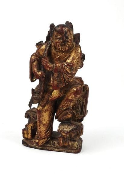 Statuette représentant un enfant Hô hô. Bois...