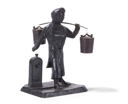 Groupe en bronze

Représentant une femme...