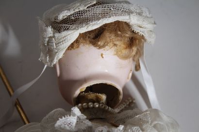 STEINER. Wiggling baby doll, head made of...