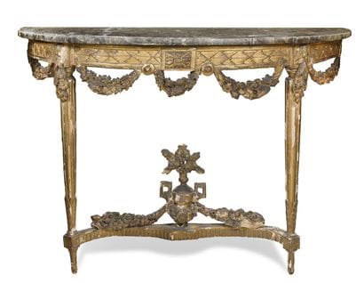 CONSOLE EN BOIS DORÉ
à décor de guirlandes...