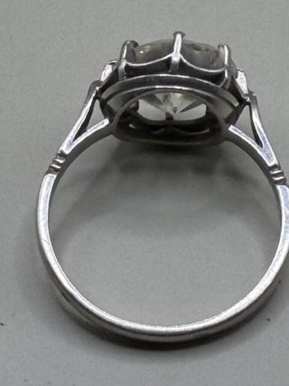 850-th platinum ring set with a single vintage-cut...