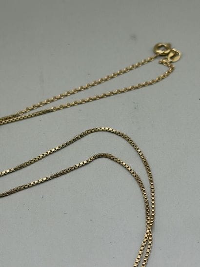 Gold necklace with a design set with ruby...