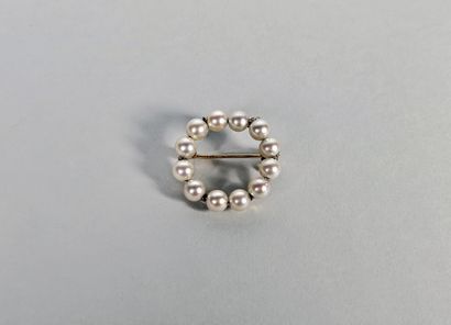 18K (750°/°°) yellow gold brooch forming...
