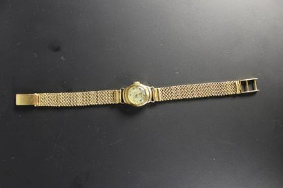 FORMI
Montre de femme en or jaune 18K (750‰),...