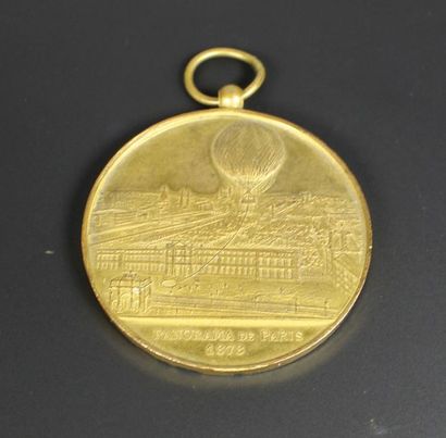 Médaille commémorative en bronze doré titrée...