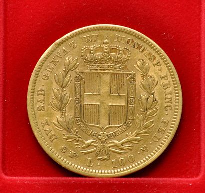 Une pièce en or de 100 lires à l'efigie de...