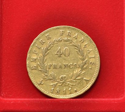 Une pièce de 40 francs or Napoléon Empereur,...