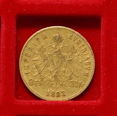 Une piece de 20 francs or ou 8 forint Francois...
