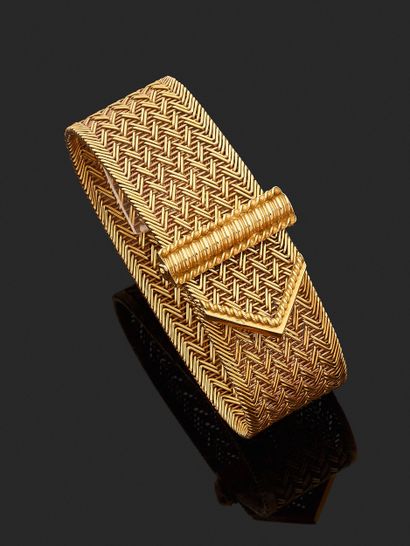 BRACELET belt in braided 750-mil. gold. Weight:...