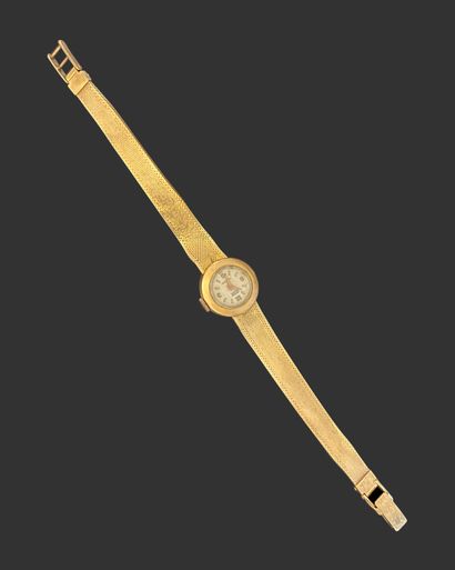 WATCH in 750 mils gold with round dial, flexible...