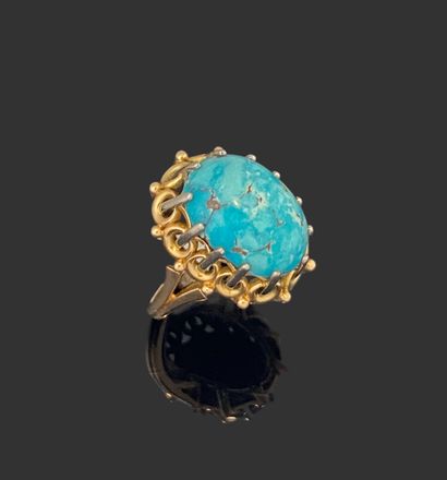 RING in yellow gold 750 mils set with a turquoise...