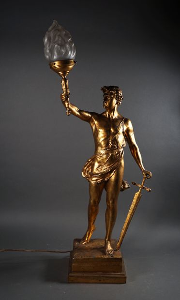 Gilded sheet metal LAMP formed of a torchbearer,...