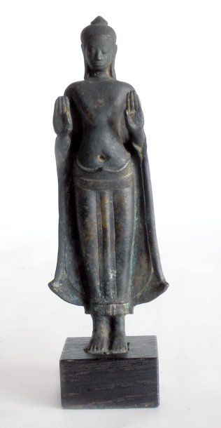 BOUDDHA debout en bronze à patine brune,...