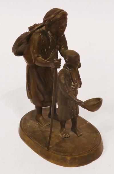 SUJET en bronze figurant un père et son enfant....