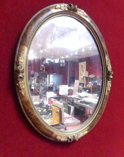 Miroir ovale le cadre à décors de fleure...
