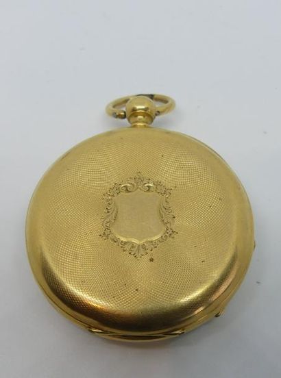 MONTRE de GOUSSET en or jaune, le dos guilloché...
