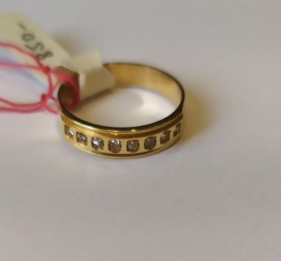 Yellow gold ring with a line of diamonds...