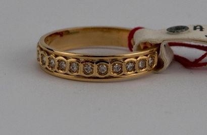 18K yellow gold wedding band adorned with...