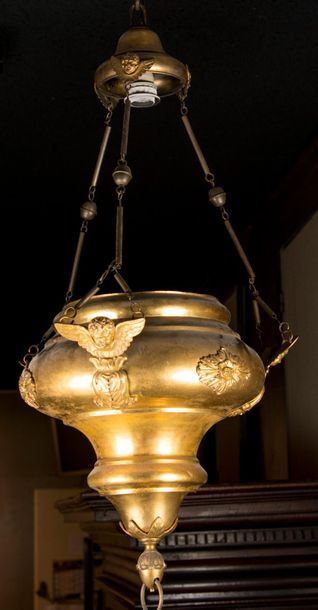 Brass chandelier decorated with three busts...