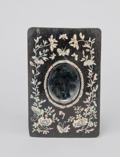 Small mirror, the frame in blackened wood...