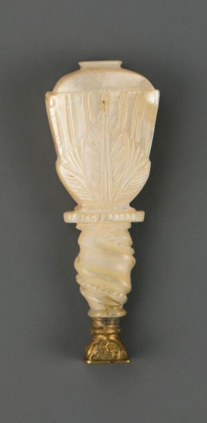 Stamp, taken in the shape of a carved ivory...