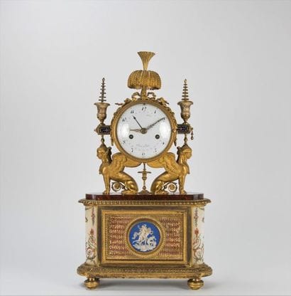 Chiselled and gilded bronze and marble clock....