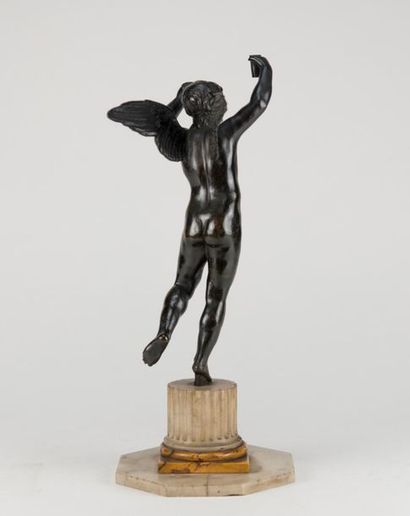 Winged genius in patinated bronze, column...