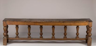 Large walnut bench with spacer carved with...