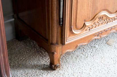 Walnut wardrobe molded and carved with flowers,...