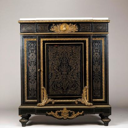 In-between cabinet made of brass veneer cut...
