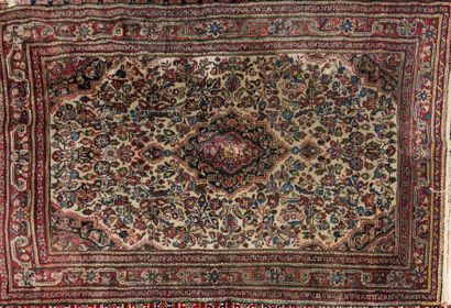 Carpet with floral decoration on a cream...