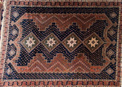Handmade Caucasus rug with a motif of 4 medallions...