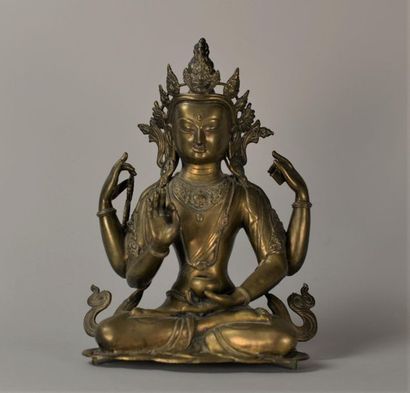 Bouddha en bronze assise sur un socle lotus...