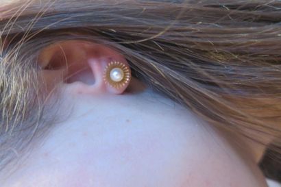 Pair of 750°/00 yellow gold sunshine earrings,...