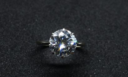 Solitaire set with a modern cut diamond of...