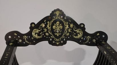 Italy 19th century. Curl armchair in blackened...