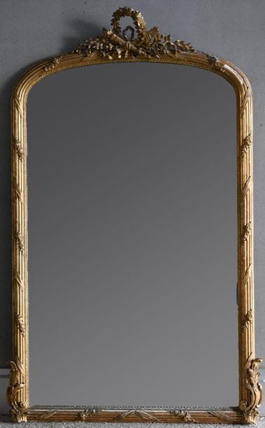 Important mirror the stuccoed and gilded...