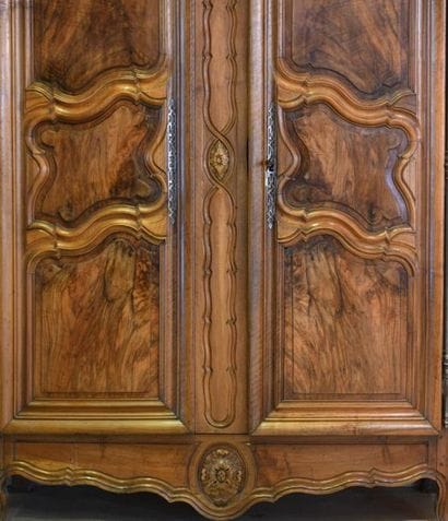 *A carved and moulded walnut cabinet, the...