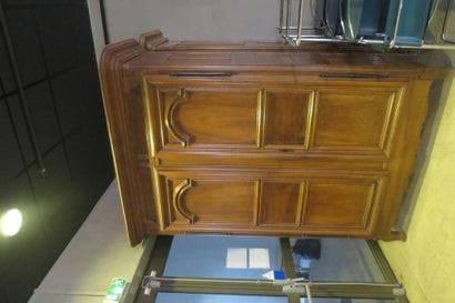 *Moulded and carved walnut cabinet on slightly...