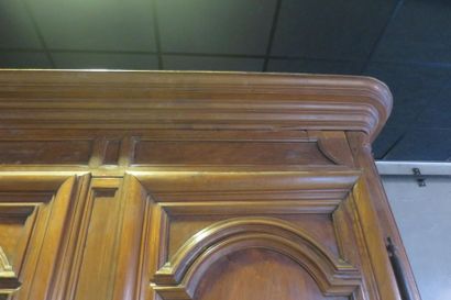 *Moulded and carved walnut cabinet on slightly...