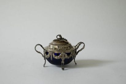 Silver covered sugar bowl with oval shape...